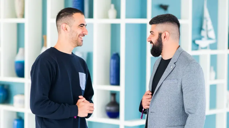 Mirror their body language subtly